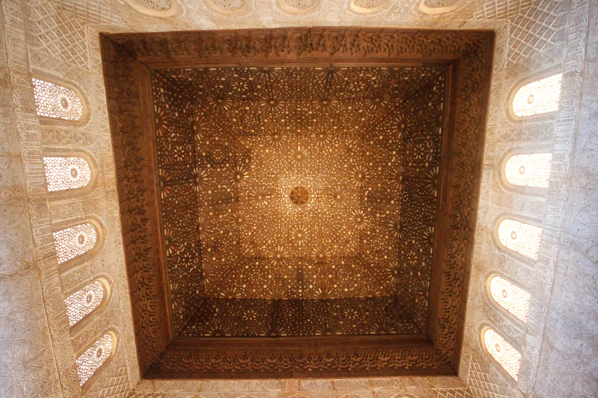 Spectacular *muqarnas* dome ceiling in Hall of Ambassadors with geometric star patterns at Alhambra