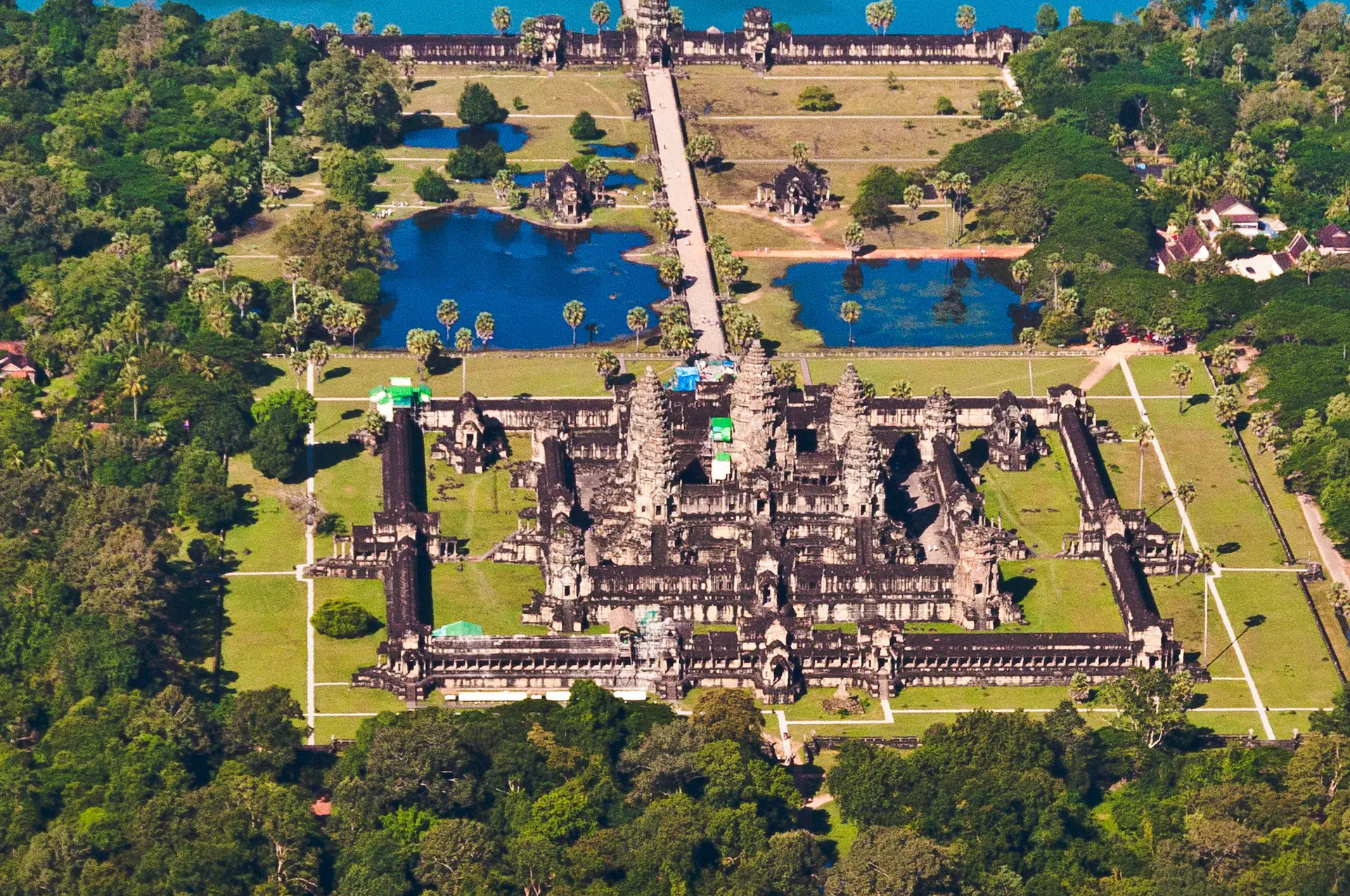 Aerial view of the Angkor temple complex showing the vast scale and layout of the ancient Khmer capital