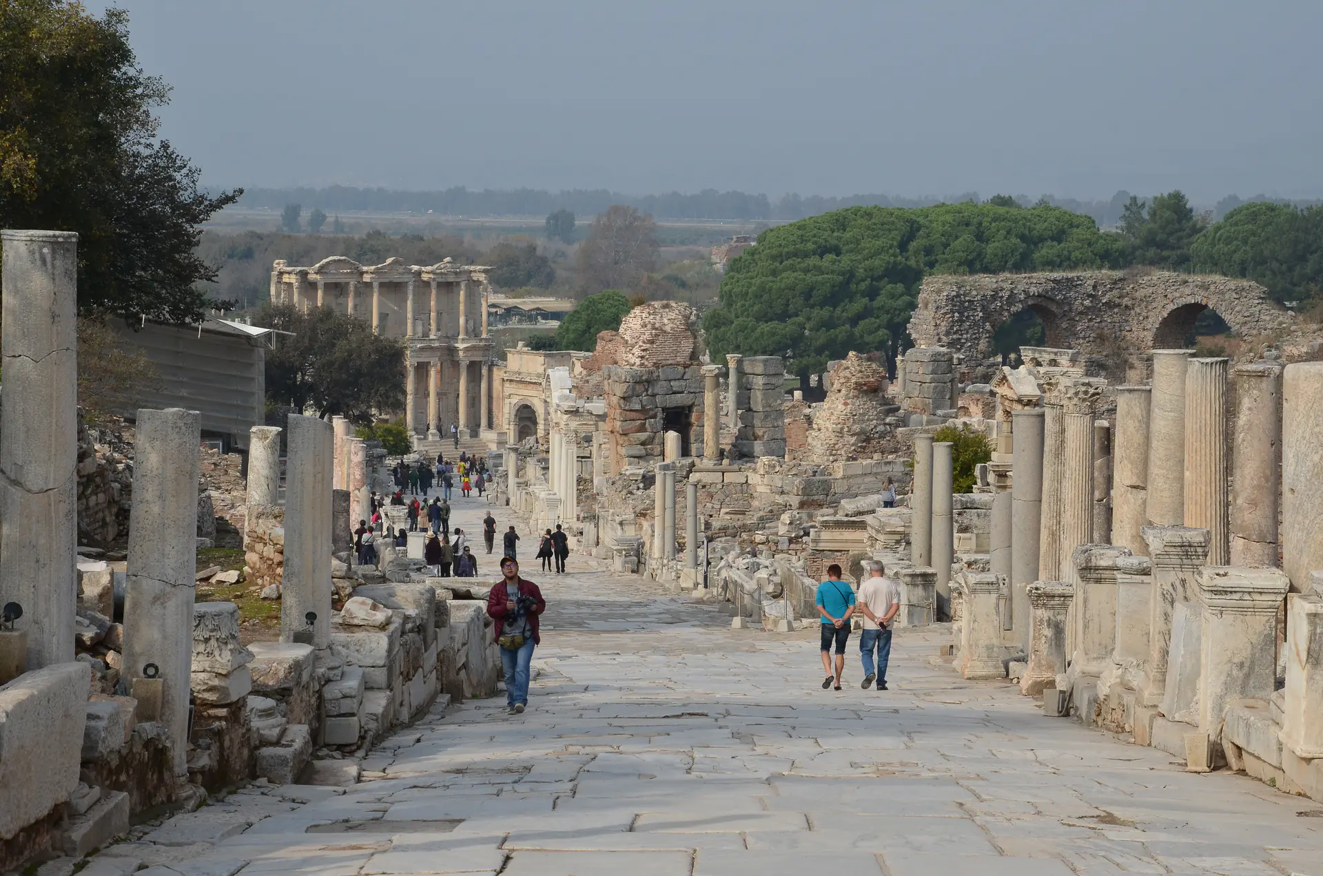 The ancient Curetes Street at Ephesus showing marble-paved roads lined with columns and ruins of shops and public buildings