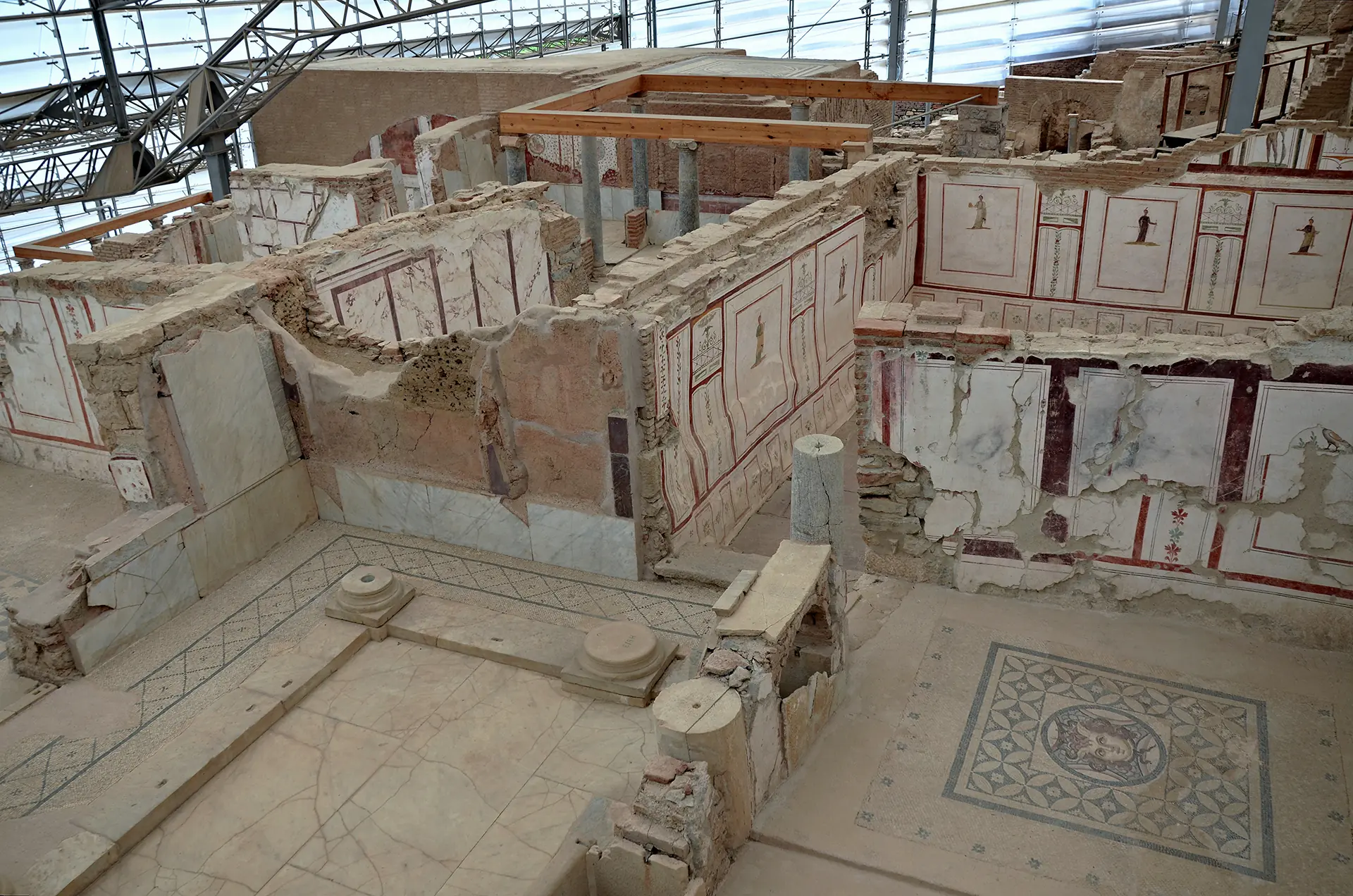 Interior walkway of the Terrace Houses at Ephesus showing multiple levels of preserved Roman luxury residences with protective modern roofing
